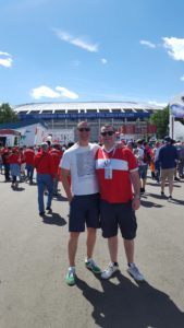 Photograph of Tosh Warwick and Duncan Stone outside a football stadium in Russia